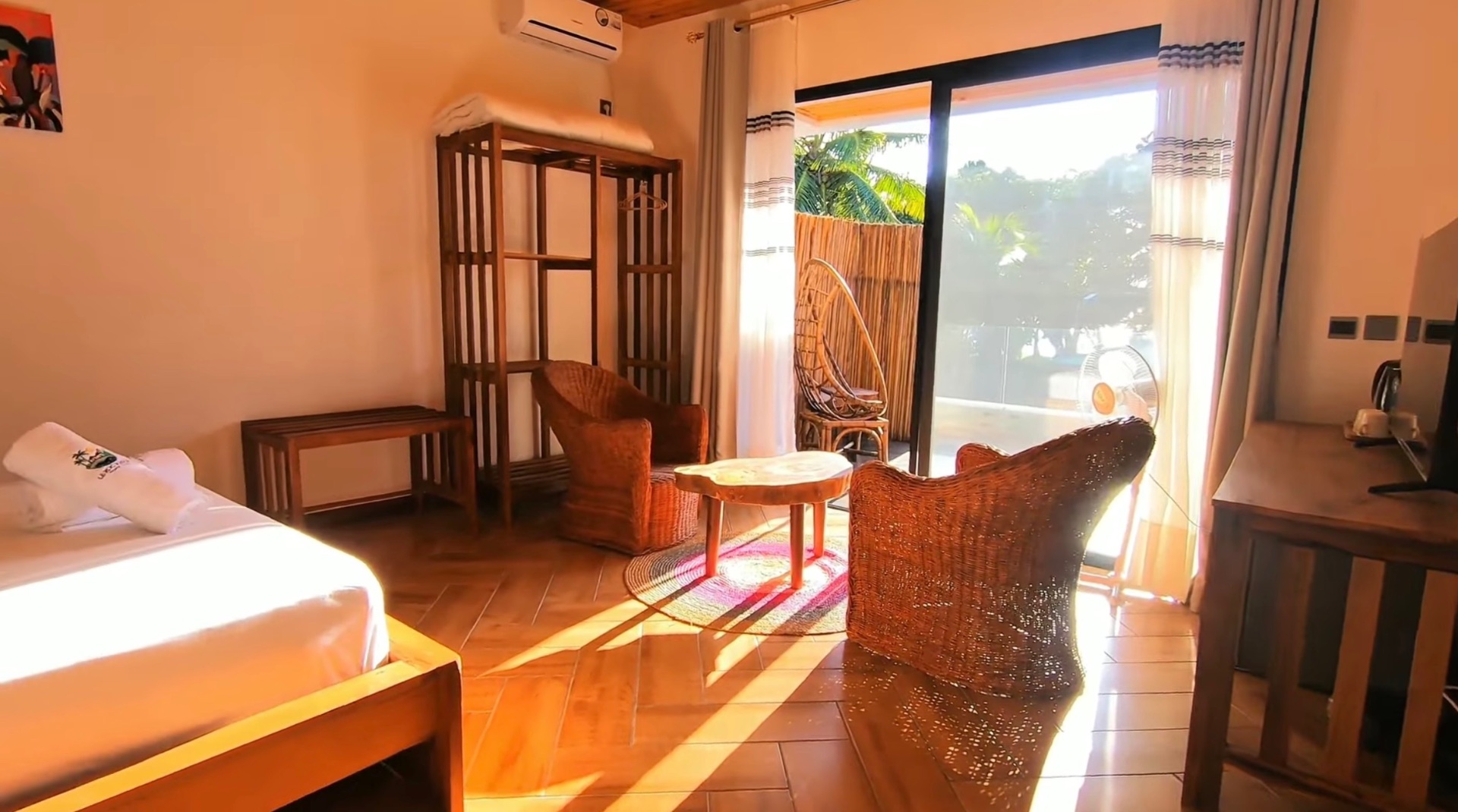A bedroom opening onto its own shaded terrace