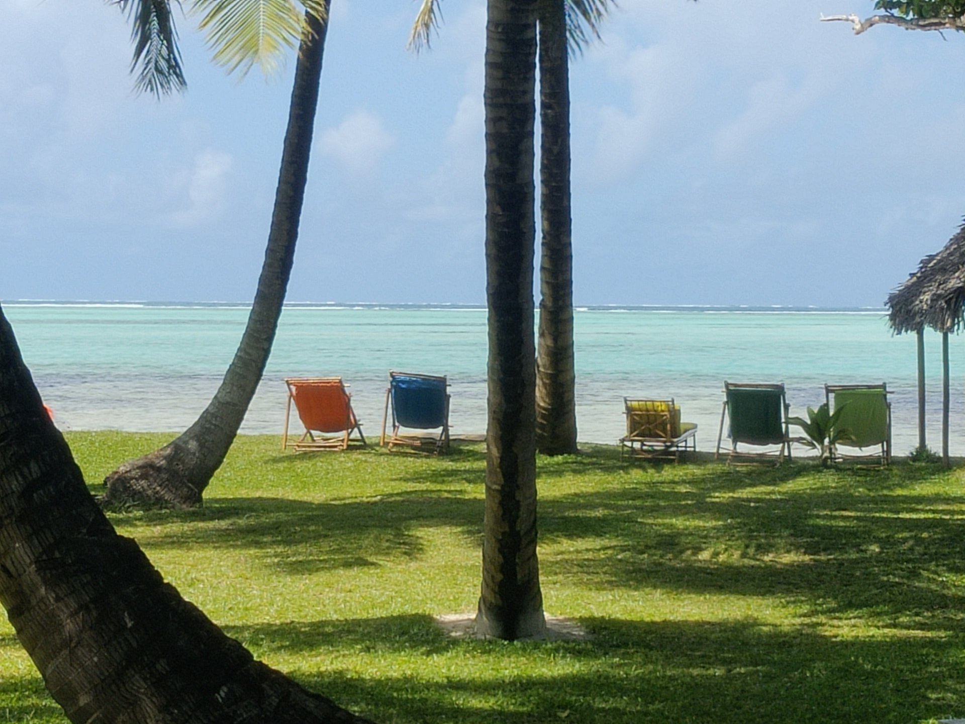 Children playing in the shallow lagoon in front of the resort