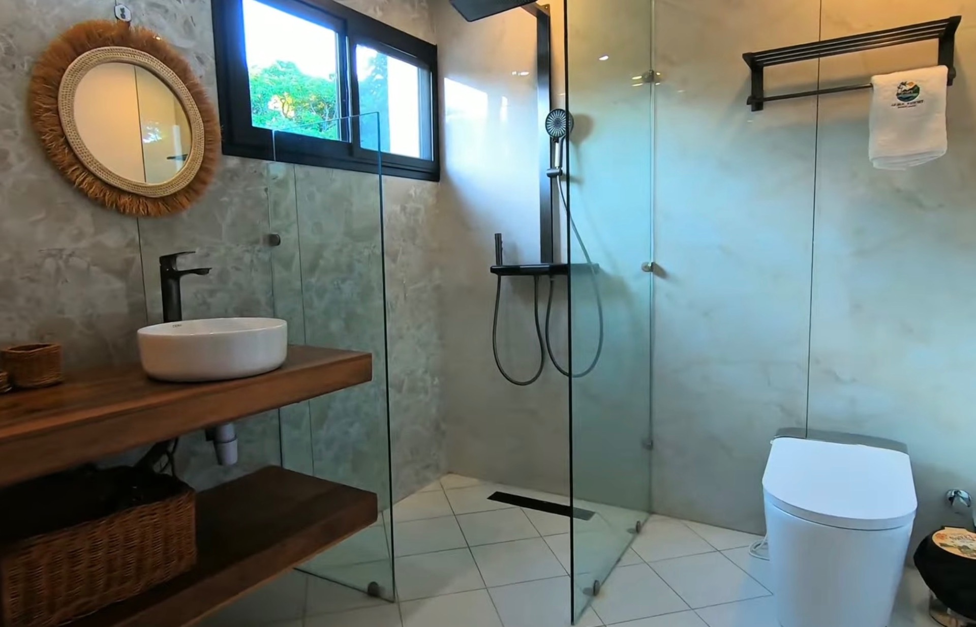 A walk-in rain shower in one of the ensuite bathrooms